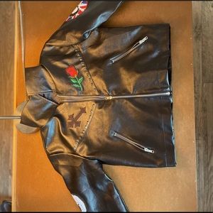 Faux leather jacket with iron-ons.